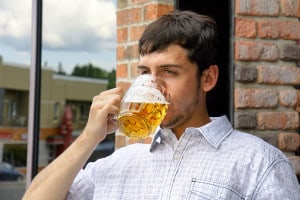 bigstock-Young-Man-Binging-On-Beer-30881735