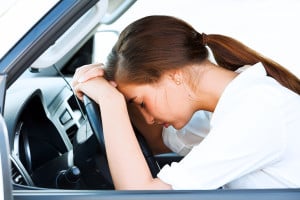 Girl sleeps in a car