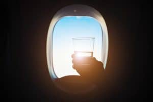 drunk-on-a-plane-lifting-glass